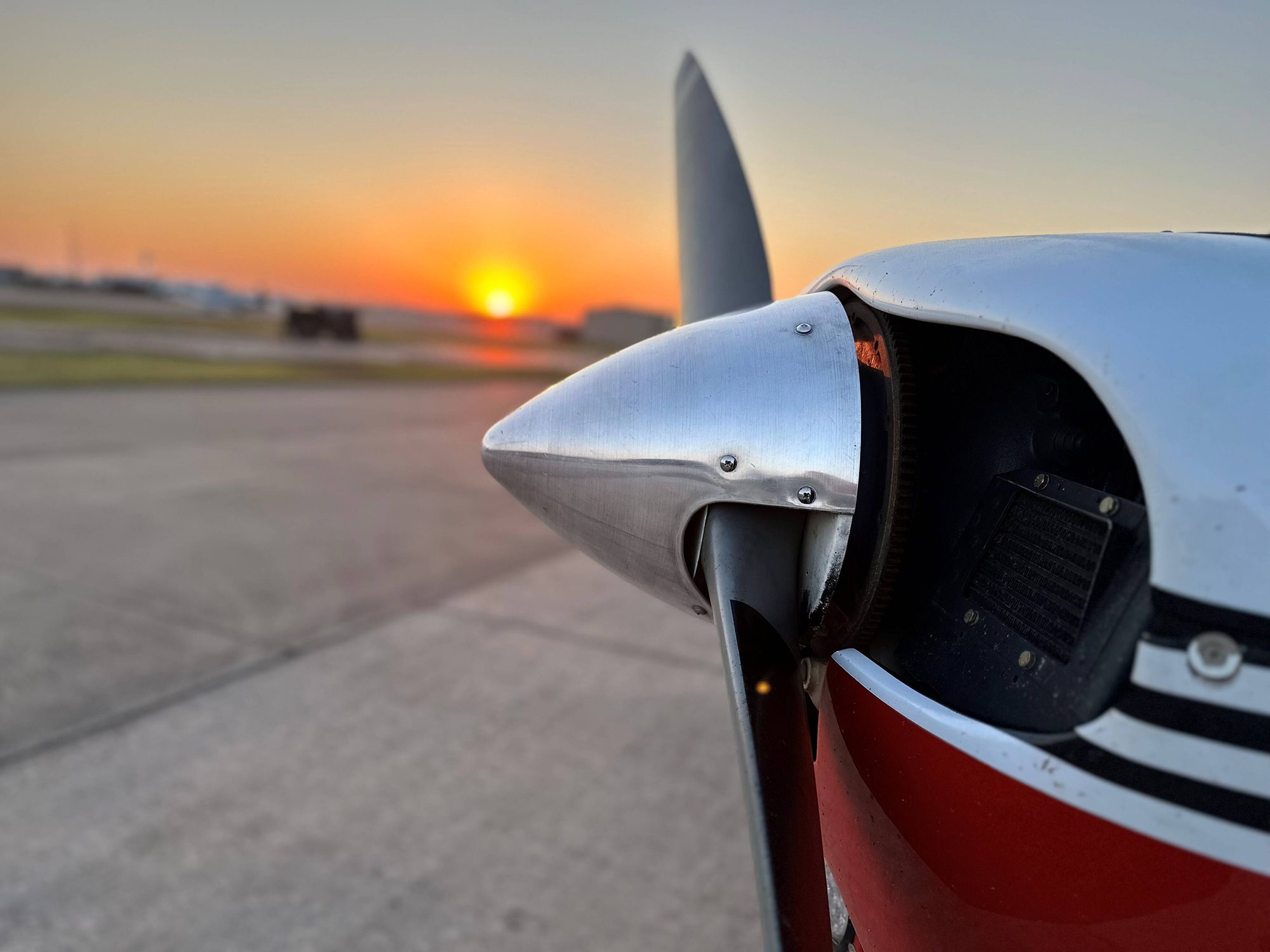 Sunset over the propeller of a training aircraft at Pearland Regional Airport